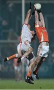 21 January 2015; Aaron Findon, right, and Ciaran McKeever, Armagh, in action against Colm Cavanagh, Tyrone. Dr. McKenna Cup Semi-Final, Armagh v Tyrone. Athletic Grounds, Armagh. Picture credit: Ramsey Cardy / SPORTSFILE