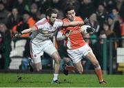 21 January 2015; Jamie Clarke, Armagh, is tackled by Ronan McNamee, Tyrone. Dr. McKenna Cup Semi-Final, Armagh v Tyrone. Athletic Grounds, Armagh. Picture credit: Ramsey Cardy / SPORTSFILE