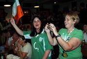 30 September 2007; Helen Woods, left, Bandbridge, Co. Down, and Sheila Foy, from Croghan, Co. Offaly, Irish volunteers at the 2007 Special Olympics World Summer Games in Shanghi, China, watch the 2007 Rugby World Cup, Pool D, Ireland v Argentina game from, Parc des Princes, Paris, France, in O'Malleys Irish Pub in Shanghai, China. Picture credit: Ray McManus / SPORTSFILE