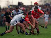 26 March 2000; Alan Browne of Cork is tackled by James O'Connor of Waterford during the Church & General National Hurling League Division 1B Round 4 match between Waterford and Cork at Walsh Park in Waterford. Photo by Aoife Rice/Sportsfile