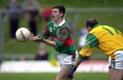 25 March 2000; Aidan Higgins of Mayo in action against Jody Devine of Meath during the Church & General National Football League Division 1B Round 6 match between Meath and Mayo at Páirc Tailteann in Navan, Meath. Photo by Damien Eagers/Sportsfile