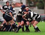 25 March 2000; Bevan Cantrell of Wanderers hooker is tackled by Anthony Ronan and David Cassidy, right, of Old Belvedere during the AIB All-Ireland League Division 2 match between Old Belvedere v Wanderers at Anglesea Road in Dublin. Photo by Ray McManus/Sportsfile