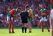 29 September 1996; Referee Pat McEnaney prepares to send off Liam McHale of Mayo and Colm Coyle of Meath after altercations between players in front of the Hill 16 goal during the All-Ireland Senior Football Championship Final Replay match between Meath and Mayo at Croke Park in Dublin. Photo Ray McManus/Sportsfile