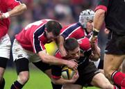 8 January 2000. Daragh O'Mahony of Saracens is tackled by John Kelly, left, and Michael Mullins of Munster during the Heineken Cup Pool 4 Round 5 match between Munster and Saracens at Thomond Park in Limerick. Photo by Matt Browne/Sportsfile