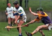 27 February 2000; Dave Bennett of Waterford is shot blocked by Donal Barry of Wexford during the Church & General National Hurling League Division 1B Round 2 match between Waterford and Wexford at Walsh Park in Waterford. Photo by Matt Browne/Sportsfile