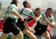 14 August 1999. David Corkery of Munster is tackled by Mel Deane and Eric Elwood of Connacht during the Guinness Interprovincial Championship match between Connacht and Munster at the Sportsground in Galway. Photo by Brendan Moran/Sportsfile