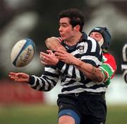 26 February 2000; David Johnson of Blackrock College RFC is tackled by Scott Taylor of Sunday Well RFC during the AIB Rugby League Division 2 match  between Blackrock College RFC and Sundays Well RFC at Stradbrook in Dublin. Photo by Ray McManus/Sportsfile