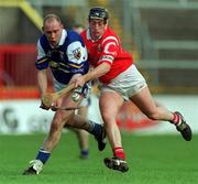 12 March 2000; Declan Conroy of Laois in action against Pat Ryan of Cork during the Church & General National Hurling League Division 1B Round 3 match between Cork and Laois at Páirc Uí Chaoimh in Cork. Photo by Brendan Moran/Sportsfile