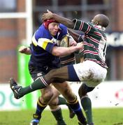 15 January 2000; Declan O'Brien of Leinster is tackled by Nnamdi Ezulike of Leicester during the Heineken Cup Pool 1 Round 6 match between Leicester and Leinster at Welford Road in Leicester, England. Photo by Brendan Moran/Sportsfile