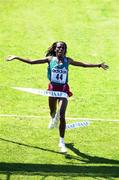 18 March 2000; Derartu Tulu of Ethiopia celebrates as she crosses the line to win the Women's Long Race 8080m during day one of the 2000 IAAF World Cross Country Championships in Villamoura, Portugal. Photo by Brendan Moran/Sportsfile