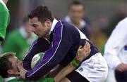 18 February 2000; Derrick Lee of Scotland holds off the tackle of Eric Miller of Ireland during the Six Nations A Rugby Championship match between Ireland and Scotland at Donnybrook Stadium in Dublin. Photo by Brendan Moran/Sportsfile
