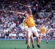 6 August 1989; Dominic McKinley of Antrim in action against Daithí Regan of Offaly during the All-Ireland Senior Hurling Championship Semi-Final match between Antrim and Offaly at Croke Park in Dublin. Photo by Ray McManus/Sportsfile