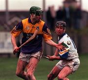 27 February 2000; Donal Berry of Wexford in action against Dave Bennett of Waterford during the Church & General National Hurling League Division 1B Round 2 match between Waterford and Wexford at Walsh Park in Waterford. Photo by Matt Browne/Sportsfile