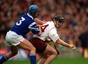 17 March 2000; Eugene Cloonan of Athenry is tackled by Donal Cahill of St Joseph's Doorabarefield during the AIB All-Ireland Senior Club Hurling Championship Final match between Athenry and St Joseph's Doorabarefield at Croke Park in Dublin. Photo by Ray McManus/Sportsfile
