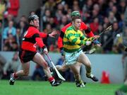 31 October 1999; Fergal Ryan of Blackrock in action against Dave Bennett of UCC during the Cork County Senior Club Hurling Championship Final match between Blackrock and UCC at Páirc Uí Chaoimh in Cork. Photo by Brendan Moran/Sportsfile