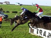 1 January 2000; Fidalus with Paul Moloney up, left, clears the last ahead of Clash of The Gales with Pat Crowley up, on their way to winning the TJ Carroll Steeplechase at Waterford and Tramore Racecourse in Waterford. Photo by Damien Eagers/Sportsfile