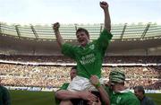 19 March 2000; Brian O'Driscoll of Ireland is held aloft by team-mate in the celebrations after the Six Nations Rugby Championship match between France and Ireland at the Stade de France in Paris, France. Photo by Matt Browne/Sportsfile