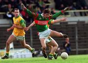 25 March 2000; James Gill of Mayo in action against Mark O'Reilly, behind, of Meath during the Church & General National Football League Division 1B Round 6 match between Meath and Mayo at Páirc Tailteann in Navan, Meath. Photo by Ray Lohan/Sportsfile