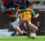 25 March 2000; James Gill of Mayo in action against Mark O'Reilly of Meath during the Church & General National Football League Division 1B Round 6 match between Meath and Mayo at Páirc Tailteann in Navan, Meath. Photo by Ray Lohan/Sportsfile