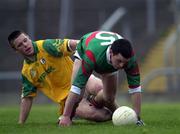 25 March 2000; Trevor Mortimer of Mayo in action against Mark O'Reilly of Meath during the Church & General National Football League Division 1B Round 6 match between Meath and Mayo at Páirc Tailteann in Navan, Meath. Photo by Damien Eagers/Sportsfile