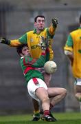 25 March 2000; James Gill of Mayo in action against Hank Traynor of Meath during the Church & General National Football League Division 1B Round 6 match between Meath and Mayo at Páirc Tailteann in Navan, Meath. Photo by Damien Eagers/Sportsfile