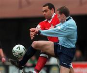 17 March 2000; James Keddy of Shelbourne is tackled by Paul Osam of St Patrick's Athletic during the Eircom League Premier Division match between St Patrick's Athletic and Shelbourne at Richmond Park in Dublin. Photo by David Maher/Sportsfile