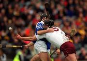17 March 2000; Joe Rabbitte of Athenry gets a pass away under pressure from Sean McMahon during the AIB All-Ireland Senior Club Hurling Championship Final match between Athenry and St Joseph's Doorabarefield at Croke Park in Dublin. Photo by Ray McManus/Sportsfile