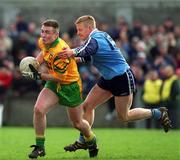 5 March 2000; John Gildea of Donegal races clear of  Declan Darcy of Dublin during the Church & General National Football League Division 1A Round 5 match between Dublin and Donegal at Parnell Park in Dublin. Photo by Ray McManus/Sportsfile