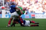 19 March 2000; Keith Wood of Ireland is tackled by Arnaud Costes and Thomas Lievremont, right, of France during the Six Nations Rugby Championship match between France and Ireland at the Stade de France in Paris, France. Photo by Ray Lohan/Sportsfile