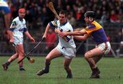 27 February 2000; Ken McGrath of Waterford is tackled by Darragh Ryan of Wexford during the Church & General National Hurling League Division 1B Round 2 match between Waterford and Wexford at Walsh Park in Waterford. Photo by Matt Browne/Sportsfile
