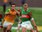 25 March 2000; Ciarán McDonald of Mayo in action against Anthony Moyles of Meath during the Church & General National Football League Division 1B Round 6 match between Meath and Mayo at Páirc Tailteann in Navan, Meath. Photo by Ray Lohan/Sportsfile