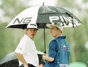 2 August 1999; Lee Westwood and his caddy shelter from the rain during day four of the Smurfit European Open at the K-Club in Straffan, Kildare. Photo by Brendan Moran/Sportsfile