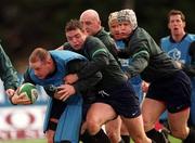 15 March 2000; Frank Sheahan is tackled by Rob Henderson during Ireland Rugby squad training at Greystones Rugby Club in Wicklow. Photo by Damien Eagers/Sportsfile