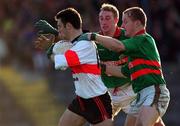 20 November 1999; Franny Halpin of UCC in action against Jason Crotty and Dan Crotty, right, of Rathgormack during the AIB Munster Senior Club Football Championship Semi-Final match between Rathgormack and UCC at Páirc Uí Rinn in Cork. Photo by Damien Eagers/Sportsfile