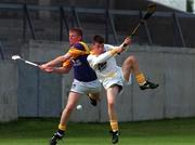 24 July 1999; Leon O'Connell of Wexford in action against Gareth Magee of Antrim during the All-Ireland Minor Hurling Championship Quarter-Final match between Antrim and Wexford at Parnell Park in Dublin. Photo by Ray Lohan/Sportsfile