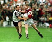 27 June 1999; Michael Donnellan of Galway is tackled by Paul Durcan of Sligo during the Bank of Ireland Connacht Senior Football Championship Semi-Final match between Sligo and Galway at Markievicz Park in Sligo. Photo by Matt Browne/Sportsfile