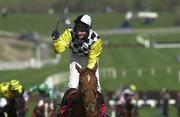 15 March 2000; Norman Williamson celebrates winning the Royal & Sunalliance Novice Hurdle on Monsignor  on day two of the Cheltenham Racing Festival at Prestbury Park in Cheltenham, England. Photo by Ray Lohan/Sportsfile