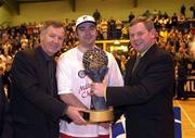10 March 2000; Neptune captain Stephen McCarthy is presented with the ESB Superleague trophy by Finn Ahern, President IBA, left, and PJ Kavanagh, ESB Cork, after Neptune were crowned ESB Superleague 1999/2000 champions after the ESB Superleague match between Neptune and Star of the Sea at Neptune Stadium in Cork. Photo by Brendan Moran/Sportsfile