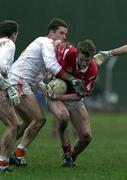 5 March 2000; Nicholas Murphy of Cork is tackled by Paul McGrane of Armagh during the Church & General National Football League Division 1A Round 5 match between Armagh and Cork at Crossmaglen Rangers GAC Club in Armagh. Photo by Damien Eagers/Sportsfile