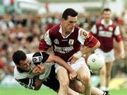 27 June 1999; Padraic Joyce of Galway is tackled by Nigel  Clancy of Sligo during the Bank of Ireland Connacht Senior Football Championship Semi-Final match between Sligo and Galway at Markievicz Park in Sligo. Photo by Matt Browne/Sportsfile