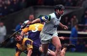 27 February 2000; Paul Flynn of Waterford in action against Donal Berry, 3, and Declan Ruth of Wexford during the Church & General National Hurling League Division 1B Round 2 match between Waterford and Wexford at Walsh Park in Waterford. Photo by Matt Browne/Sportsfile