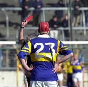 26 March 2000; Referee Pat O'Connor issues the red card to Eddie Tucker of Tipperary during the Church & General National Hurling League Division 1B Round 4 match between Tipperary and Kilkenny at Nowlan Park in Kilkenny. Photo by Ray McManus/Sportsfile