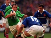 19 March 2000; Rob Henderson of Ireland in action against Emile N'Tamack, 15, of France during the Six Nations Rugby Championship match between France and Ireland at the Stade de France in Paris, France. Photo by Matt Browne/Sportsfile *** Local Caption ***