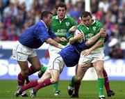 19 March 2000; Rob Henderson of Ireland is tackled by Gerald Merceron and Thomas Lievremont of France during the Six Nations Rugby Championship match between France and Ireland at the Stade de France in Paris, France. Photo by Matt Browne/Sportsfile *** Local Caption ***