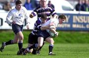 25 March 2000; Ronan O'Gara of Cork Constitution holds off the tackle of Michael Smyth of Terenure during the AIB All-Ireland League Division 1 match between Cork Constitution and Terenure at Temple Hill in Cork. Photo by Brendan Moran/Sportsfile