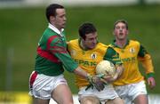 25 March 2000; Stephen Dillion of Meath in action against David Brady of Mayo during the Church & General National Football League Division 1B Round 6 match between Meath and Mayo at Páirc Tailteann in Navan, Meath. Photo by Damien Eagers/Sportsfile