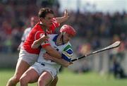 26 March 2000; Stephen Frampton of Waterford is tackled by Alan Browne of Cork during the Church & General National Hurling League Division 1B Round 4 match between Waterford and Cork at Walsh Park in Waterford. Photo by Aoife Rice/Sportsfile