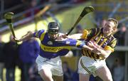 26 March 2000; Thomas Dunne of Tipperary in action against Johnny Butler of Kilkenny during the Church & General National Hurling League Division 1B Round 4 match between Tipperary and Kilkenny at Nowlan Park in Kilkenny. Photo by Ray McManus/Sportsfile