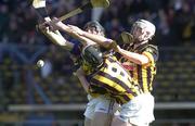 26 March 2000; Mark O'Leary of Tipperary in action against Aidan Cummins and Peter Barry, 9, of Kilkenny during the Church & General National Hurling League Division 1B Round 4 match between Tipperary and Kilkenny at Nowlan Park in Kilkenny. Photo by Ray McManus/Sportsfile