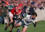 26 March 2000; Tony Browne of Waterford is tackled by Seán McGrath of Cork during the Church & General National Hurling League Division 1B Round 4 match between Waterford and Cork at Walsh Park in Waterford. Photo by Aoife Rice/Sportsfile